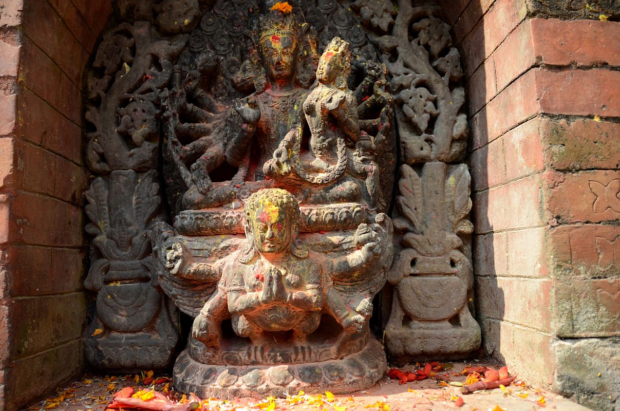 Kathmandu Changu Narayan 13 Vishnu With 12 Arms, Seven Heads Including Boar And Lion Heads Riding Garuda With Lakshmi On Lap Just to the left of the Kileshwor Temple at Changu Narayan is Vishnu with 12 arms and 7 heads, including boar and lion heads, riding on Garuda with Lakshmi (Laxmi) on his lap.